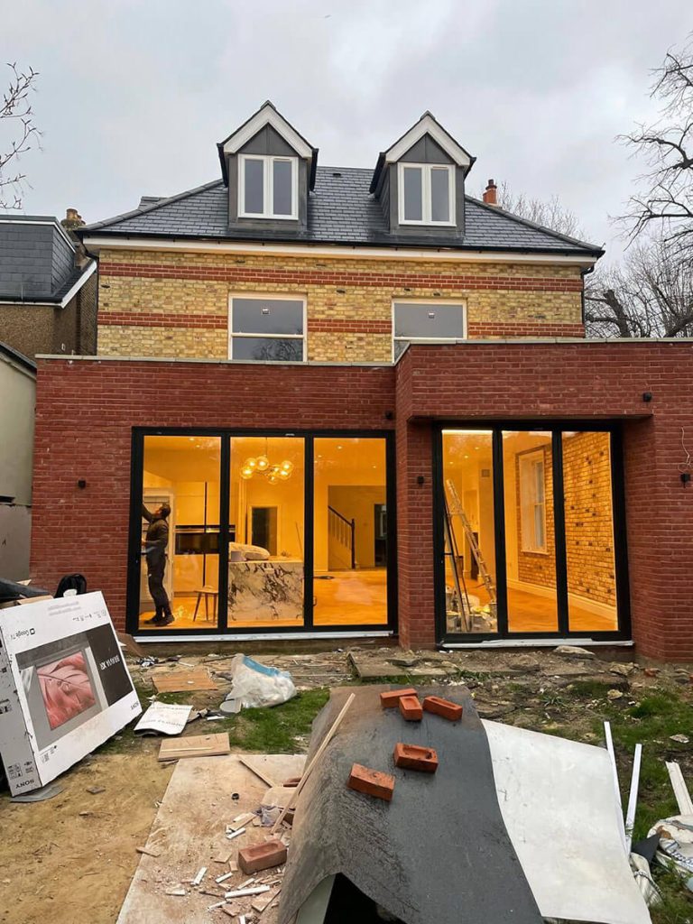 Builders working on a home extension in London